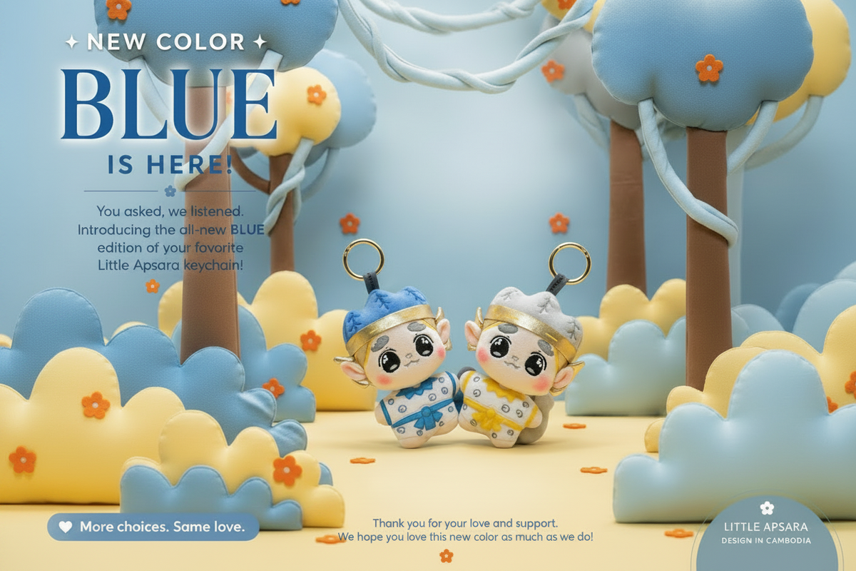 Promotional graphic for the Little Apsara keychain in a new blue edition, featuring two cute cartoon keychains in a stylized 3D scene with clouds, trees, and text overlays.